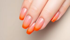 Paznokcie różowo pomarańczowe w stylu ombre gradient na migdałowych paznokciach